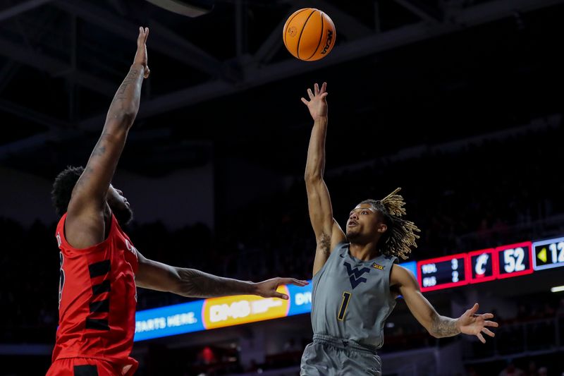 Mar 9, 2024; Cincinnati, Ohio, USA; West Virginia Mountaineers guard Noah Farrakhan (1) shoots against Cincinnati Bearcats forward Jamille Reynolds (13) in the second half at Fifth Third Arena. Mandatory Credit: Katie Stratman-USA TODAY Sports