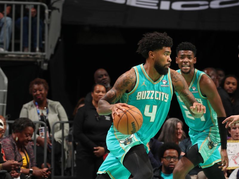 CHARLOTTE, NC - MARCH 27: Nick Richards #4 of the Charlotte Hornets goes to the basket during the game on March 27, 2024 at Spectrum Center in Charlotte, North Carolina. NOTE TO USER: User expressly acknowledges and agrees that, by downloading and or using this photograph, User is consenting to the terms and conditions of the Getty Images License Agreement. Mandatory Copyright Notice: Copyright 2024 NBAE (Photo by Kent Smith/NBAE via Getty Images)