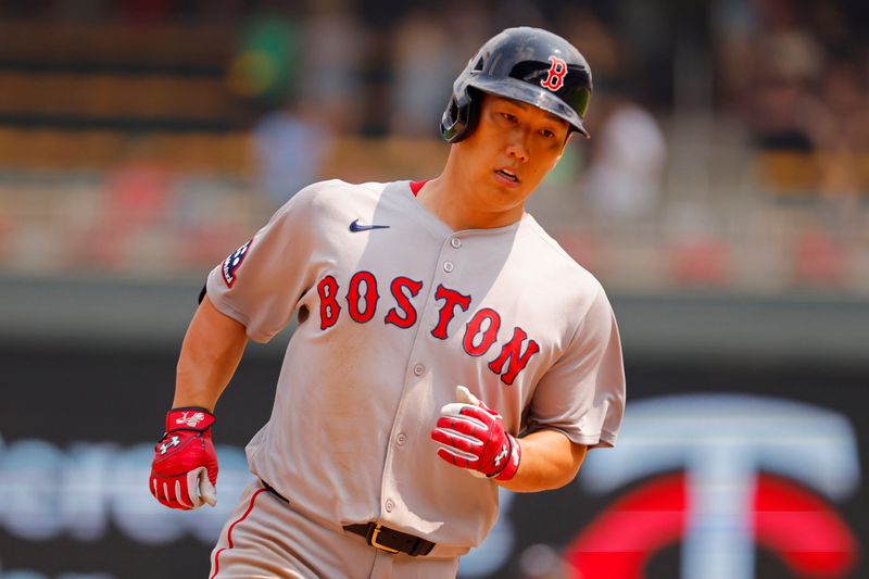 Jul 30, 2025; Minneapolis, Minnesota, USA; Boston Red Sox designated hitter Masataka Yoshida (7) runs the bases on his solo home run against the Minnesota Twins in the ninth inning at Target Field. Mandatory Credit: Bruce Kluckhohn-Imagn Images