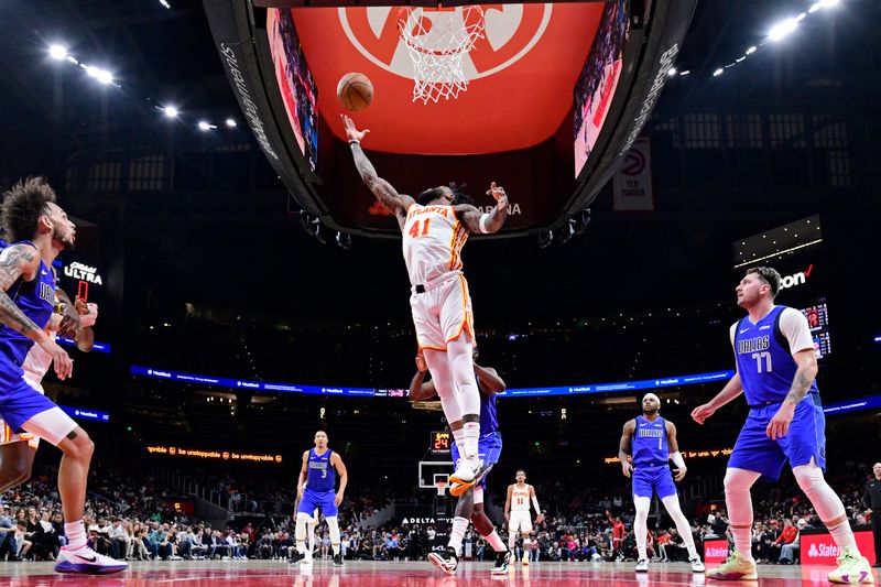 ATLANTA, GA - JANUARY 26: Saddiq Bey #41 of the Atlanta Hawks rebounds during the game against the Dallas Mavericks on January 26, 2024 at State Farm Arena in Atlanta, Georgia.  NOTE TO USER: User expressly acknowledges and agrees that, by downloading and/or using this Photograph, user is consenting to the terms and conditions of the Getty Images License Agreement. Mandatory Copyright Notice: Copyright 2024 NBAE (Photo by Adam Hagy/NBAE via Getty Images)