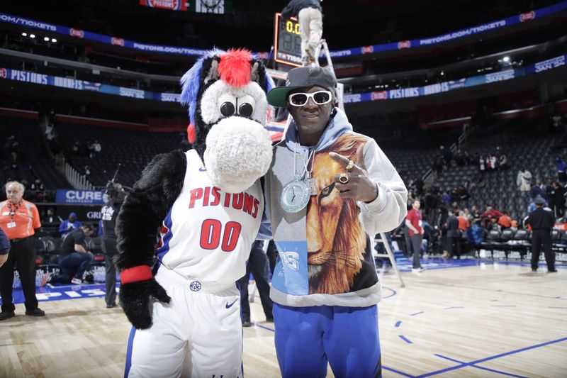 DETROIT, MI - JANUARY 22:  Mascot Hooper of the Detroit Pistons poses for a photo with Flava Flav after the game between the Milwaukee Bucks  and Detroit Pistons on January 22, 2024 at Little Caesars Arena in Detroit, Michigan. NOTE TO USER: User expressly acknowledges and agrees that, by downloading and/or using this photograph, User is consenting to the terms and conditions of the Getty Images License Agreement. Mandatory Copyright Notice: Copyright 2024 NBAE (Photo by Brian Sevald/NBAE via Getty Images)