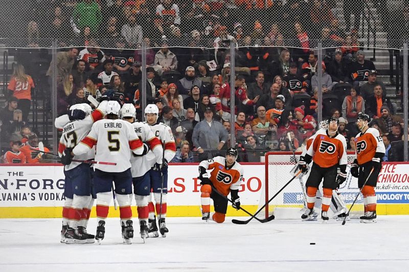 Dec 5, 2024; Philadelphia, Pennsylvania, USA; Florida Panthers center Sam Reinhart (13) celebrates his goal with teammates against the Philadelphia Flyers during the third period at Wells Fargo Center. Mandatory Credit: Eric Hartline-Imagn Images