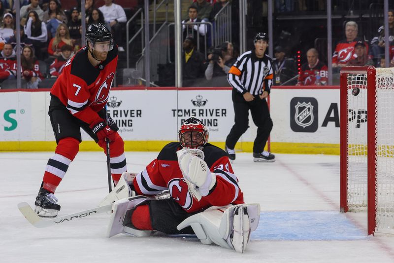 Oct 25, 2024; Newark, New Jersey, USA; New York Islanders left wing Anders Lee (27) (not shown) scores a goal on New Jersey Devils goaltender Jake Allen (34) during the first period at Prudential Center. Mandatory Credit: Ed Mulholland-Imagn Images