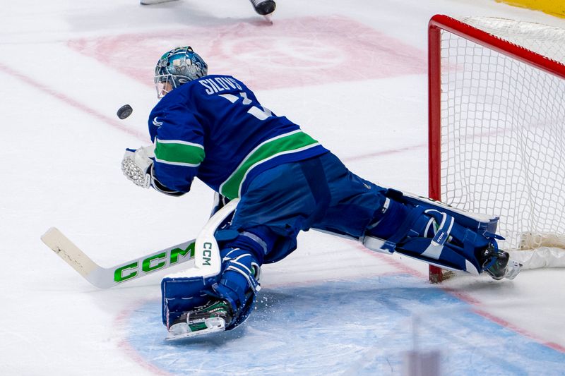 Nov 16, 2024; Vancouver, British Columbia, CAN; Vancouver Canucks goalie Arturs Silovs (31) makes a save against the Chicago Blackhawks during the second period at Rogers Arena. Mandatory Credit: Bob Frid-Imagn Images