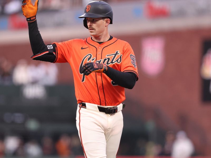 May 2, 2025; San Francisco, California, USA; San Francisco Giants right fielder Mike Yastrzemski (5) gestures to the Giants bench after hitting a single against the Colorado Rockies during the first inning at Oracle Park. Mandatory Credit: Kelley L Cox-Imagn Images