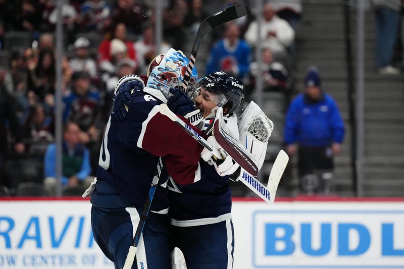 Mar 4, 2024; Denver, Colorado, USA; Colorado Avalanche goaltender Justus Annunen (60) and defenseman Samuel Girard (49) celebrate defeating the Chicago Blackhawks  at Ball Arena. Mandatory Credit: Ron Chenoy-USA TODAY Sports