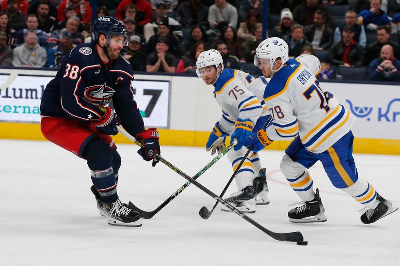 Feb 23, 2024; Columbus, Ohio, USA; Columbus Blue Jackets center Boone Jenner (38) skates the puck past Buffalo Sabres defenseman Jacob Bryson (78) during the third period at Nationwide Arena. Mandatory Credit: Russell LaBounty-USA TODAY Sports