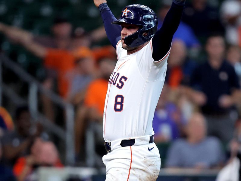 May 28, 2025; Houston, Texas, USA; Houston Astros first baseman Christian Walker (8) reacts after scoring a run against the Athletics during the fourth inning at Daikin Park. Mandatory Credit: Erik Williams-Imagn Images