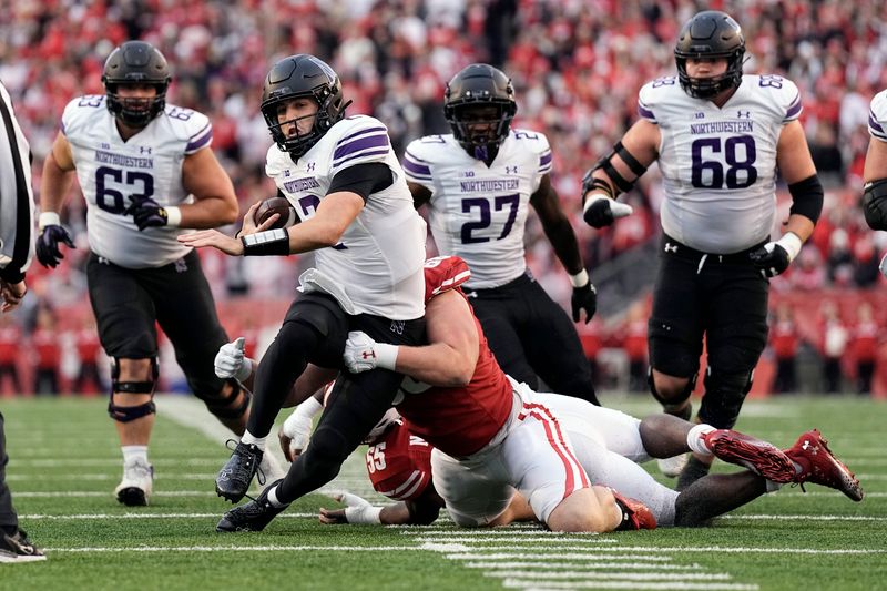 Nov 11, 2023; Madison, Wisconsin, USA;  Northwestern Wildcats quarterback Ben Bryant (2) rushes with the football during the second quarter against the Wisconsin Badgers at Camp Randall Stadium. Mandatory Credit: Jeff Hanisch-USA TODAY Sports