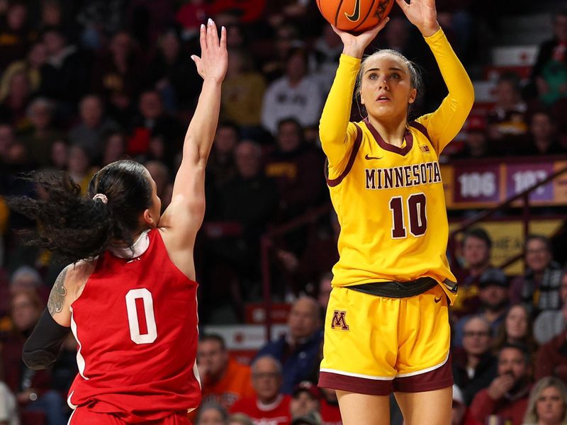 Jan 14, 2024; Minneapolis, Minnesota, USA; Minnesota Golden Gophers guard Mara Braun (10) shoots as Nebraska Cornhuskers guard Darian White (0) defends during the first half at Williams Arena. Mandatory Credit: Matt Krohn-USA TODAY Sports