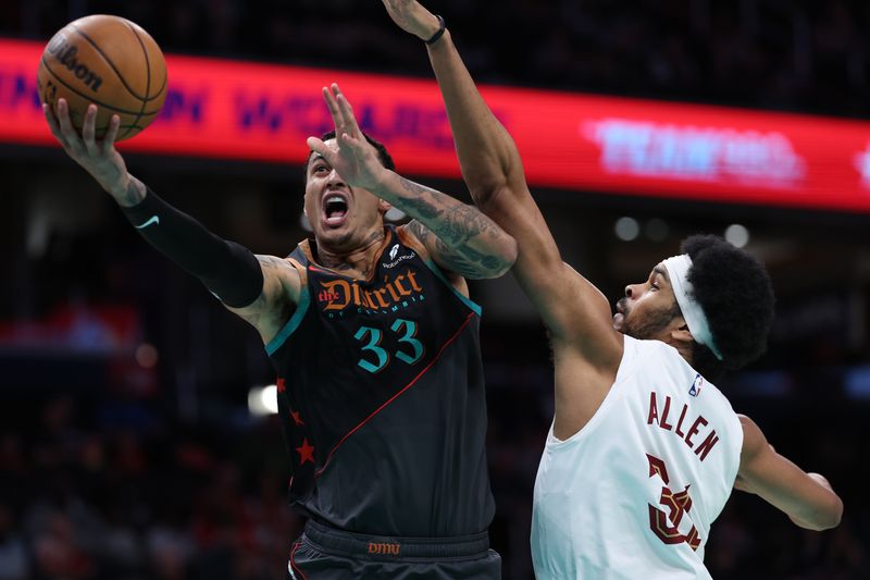 WASHINGTON, DC - FEBRUARY 25: Kyle Kuzma #33 of the Washington Wizards shoots in front of Jarrett Allen #31 of the Cleveland Cavaliers during the first half at Capital One Arena on February 25, 2024 in Washington, DC. NOTE TO USER: User expressly acknowledges and agrees that, by downloading and or using this photograph, User is consenting to the terms and conditions of the Getty Images License Agreement. (Photo by Patrick Smith/Getty Images)