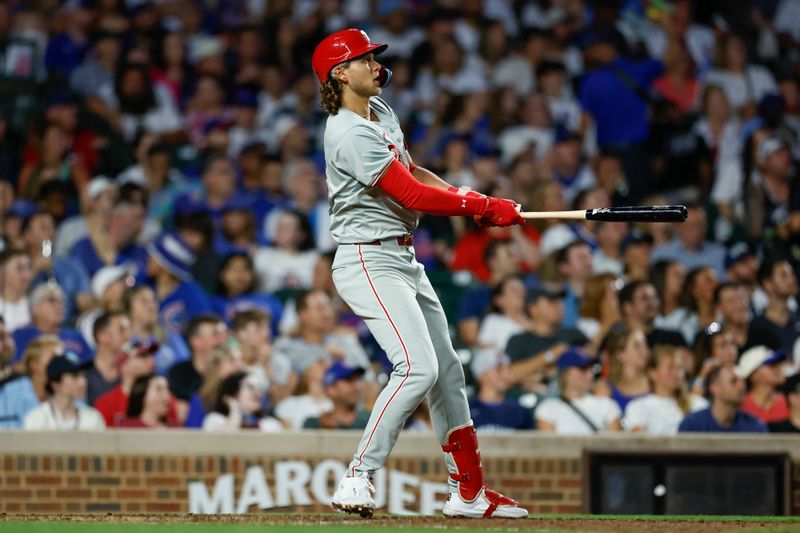 Jul 3, 2024; Chicago, Illinois, USA; Philadelphia Phillies third baseman Alec Bohm (28) hits a two-run home run against the Chicago Cubs during the sixth inning at Wrigley Field. Mandatory Credit: Kamil Krzaczynski-USA TODAY Sports