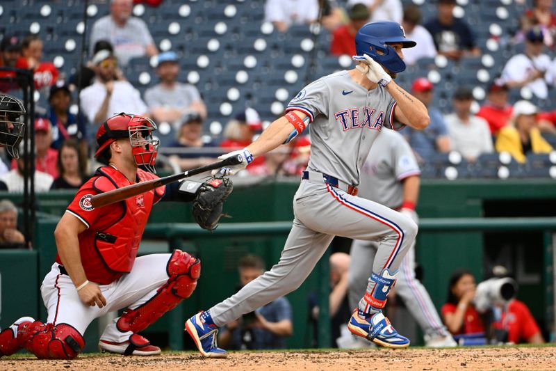 Jun 8, 2025; Washington, District of Columbia, USA; Texas Rangers center fielder Evan Carter (32) singles against the Washington Nationals during the sixth inning at Nationals Park. Mandatory Credit: Brad Mills-Imagn Images