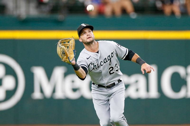 Aug 2, 2023; Arlington, Texas, USA; Chicago White Sox left fielder Andrew Benintendi (23) makes a running catch during the fourth inning against the Texas Rangers at Globe Life Field. Mandatory Credit: Andrew Dieb-USA TODAY Sports