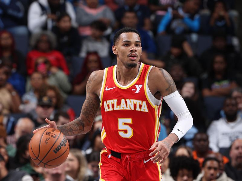 MEMPHIS, TN - MARCH 8: Dejounte Murray #5 of the Atlanta Hawks dribbles the ball during the game against the Memphis Grizzlies on March 8, 2024 at FedExForum in Memphis, Tennessee. NOTE TO USER: User expressly acknowledges and agrees that, by downloading and or using this photograph, User is consenting to the terms and conditions of the Getty Images License Agreement. Mandatory Copyright Notice: Copyright 2024 NBAE (Photo by Joe Murphy/NBAE via Getty Images)