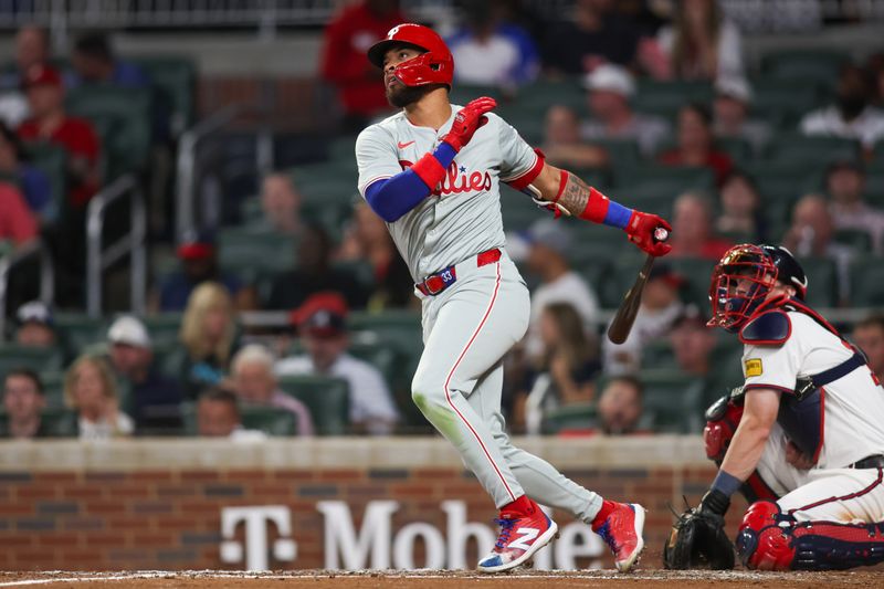 Aug 21, 2024; Atlanta, Georgia, USA; Philadelphia Phillies second baseman Edmundo Sosa (33) hits a single against the Atlanta Braves in the sixth inning at Truist Park. Mandatory Credit: Brett Davis-USA TODAY Sports