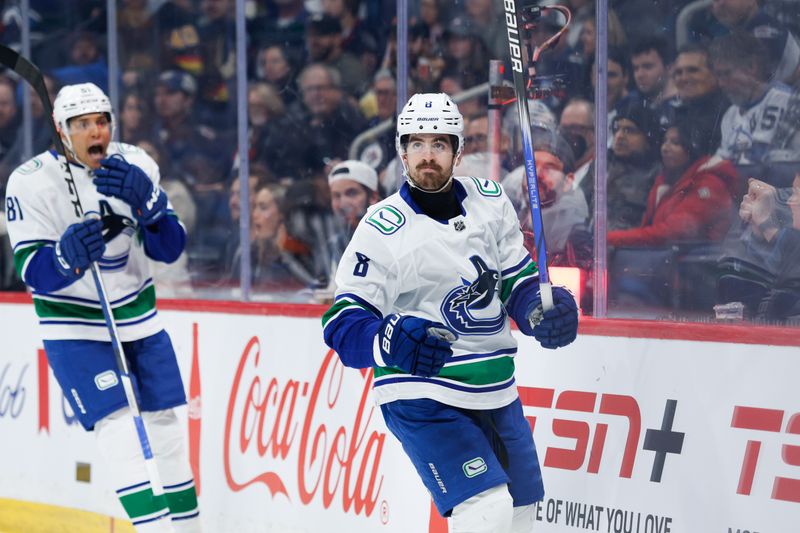 Apr 18, 2024; Winnipeg, Manitoba, CAN;  Vancouver Canucks forward Conor Garland (8) celebrates his goal against the Winnipeg Jets during the first period at Canada Life Centre. Mandatory Credit: Terrence Lee-USA TODAY Sports