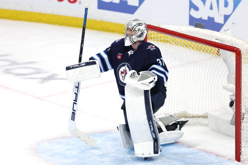 May 9, 2025; Winnipeg, Manitoba, CAN; Winnipeg Jets goaltender Connor Hellebuyck (37) takes a break against the Dallas Stars in the last minutes of the third period in game two of the second round of the 2025 Stanley Cup Playoffs at Canada Life Centre. Mandatory Credit: James Carey Lauder-Imagn Images