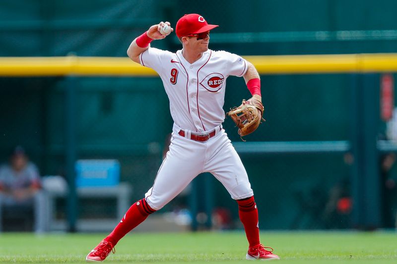 Aug 6, 2023; Cincinnati, Ohio, USA; Cincinnati Reds second baseman Matt McLain (9) throws to first to get Washington Nationals designated hitter Joey Meneses (not pictured) out in the second inning at Great American Ball Park. Mandatory Credit: Katie Stratman-USA TODAY Sports