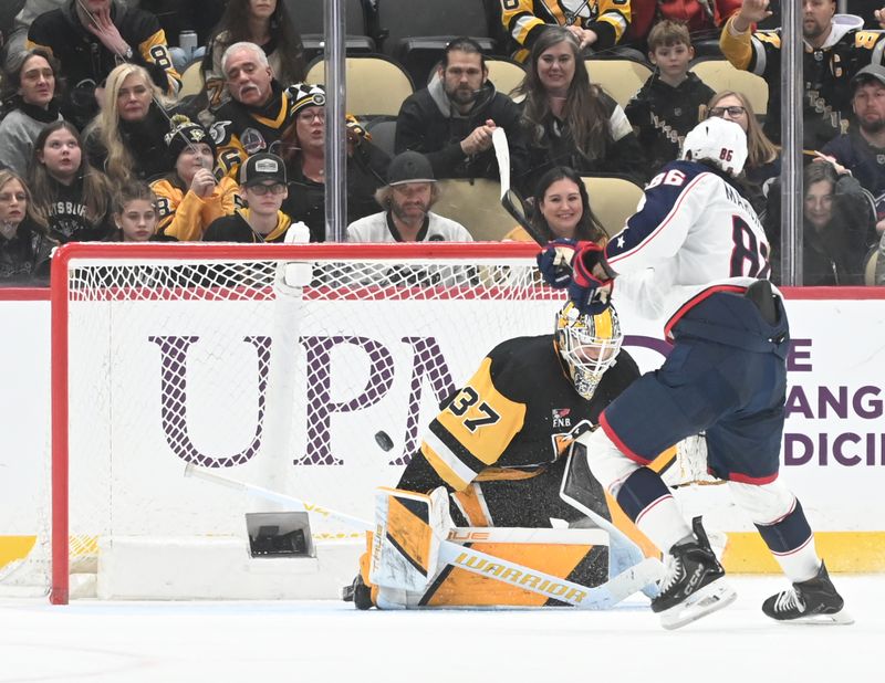 Jan 17, 2026; Pittsburgh, Pennsylvania, USA;  Columbus Blue Jackets right wing Kirill Marchenko (86) scores on Pittsburgh Penguins center goalie Arturs Silovs (37) in a shoot out at PPG Paints Arena. Columbus won 4-3.  Mandatory Credit: Philip G. Pavely-Imagn Images