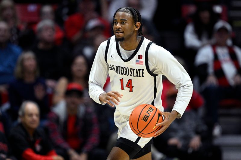 Jan 3, 2024; San Diego, California, USA; San Diego State Aztecs guard Reese Waters (14) looks to pass against Fresno State Bulldogs during the first half at Viejas Arena. Mandatory Credit: Orlando Ramirez-USA TODAY Sports 