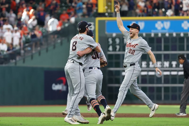 Oct 2, 2024; Houston, Texas, USA; Detroit Tigers outfielder Matt Vierling (8) and outfielder Kerry Carpenter (30) celebrate with outfielder Parker Meadows (22) after defeating the Houston Astros in game two of the Wildcard round for the 2024 MLB Playoffs at Minute Maid Park. Mandatory Credit: Thomas Shea-Imagn Images