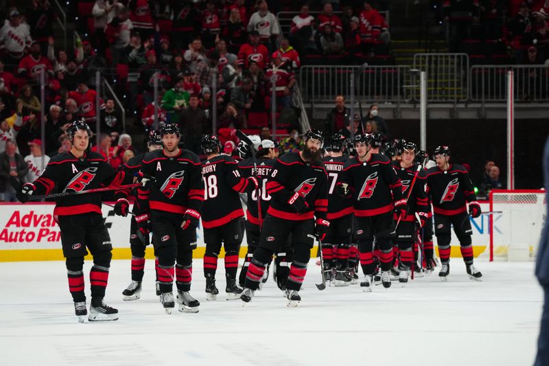 Jan 19, 2024; Raleigh, North Carolina, USA; Carolina Hurricanes players celebrate their victory against the Detroit Red Wings at PNC Arena. Mandatory Credit: James Guillory-USA TODAY Sports