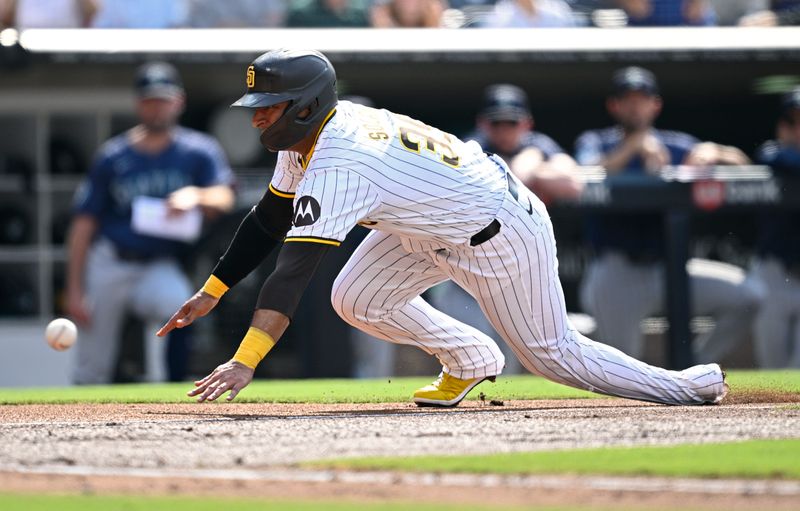 Jul 10, 2024; San Diego, California, USA; San Diego Padres third baseman Donovan Solano (39) slides home late and is tagged out during the second inning against the Seattle Mariners at Petco Park. Mandatory Credit: Orlando Ramirez-USA TODAY Sports