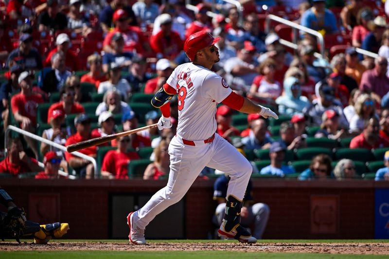 Aug 22, 2024; St. Louis, Missouri, USA;  St. Louis Cardinals third baseman Nolan Arenado (28) hits a one run single against the Milwaukee Brewers during the seventh inning at Busch Stadium. Mandatory Credit: Jeff Curry-USA TODAY Sports