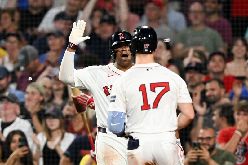 Jun 25, 2024; Boston, Massachusetts, USA; Boston Red Sox left fielder Tyler O'Neill (17) celebrates with first baseman Dominic Smith (2) after hitting a two-run home run against the Toronto Blue Jays during the sixth inning at Fenway Park. Mandatory Credit: Brian Fluharty-USA TODAY Sports