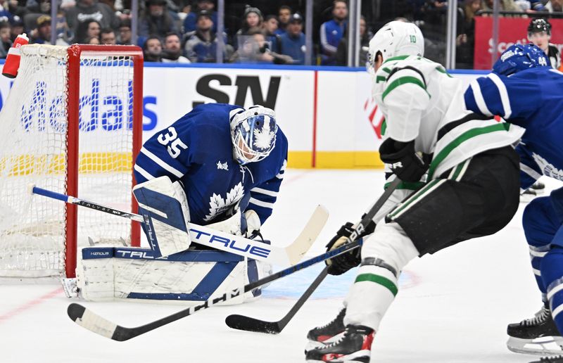 Feb 7, 2024; Toronto, Ontario, CAN; Toronto Maple Leafs goalie Ilya Samsonov (35) makes a save against Dallas Stars forward Ty Dellandrea (10) in the second period at Scotiabank Arena. Mandatory Credit: Dan Hamilton-USA TODAY Sports