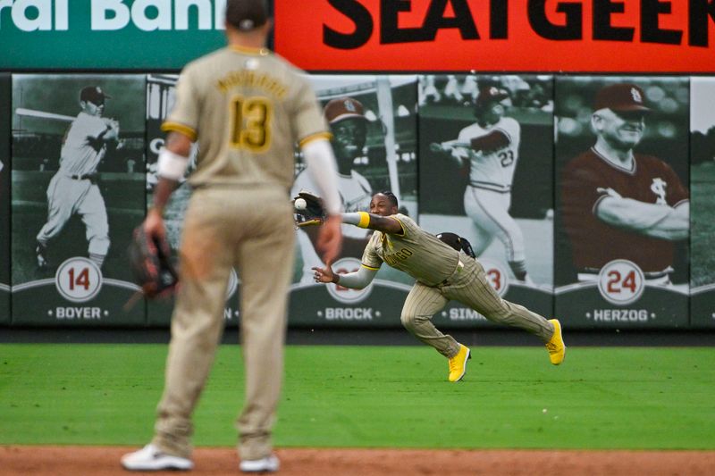 Aug 28, 2024; St. Louis, Missouri, USA;  San Diego Padres left fielder Jurickson Profar (10) dives and makes a catch against the St. Louis Cardinals during the second inning at Busch Stadium. Mandatory Credit: Jeff Curry-USA TODAY Sports