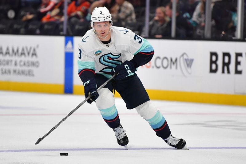 Apr 5, 2024; Anaheim, California, USA; Seattle Kraken defenseman Will Borgen (3) moves the puck against the Anaheim Ducks during the third period at Honda Center. Mandatory Credit: Gary A. Vasquez-USA TODAY Sports