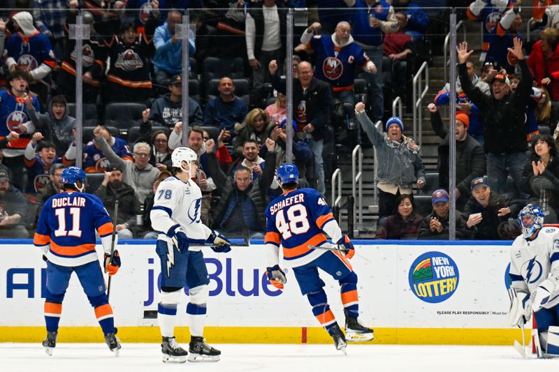 Dec 13, 2025; Elmont, New York, USA; New York Islanders defenseman Matthew Schaefer (48) celebrates his goal against the Tampa Bay Lightning during the first period at UBS Arena. Mandatory Credit: Dennis Schneidler-Imagn Images