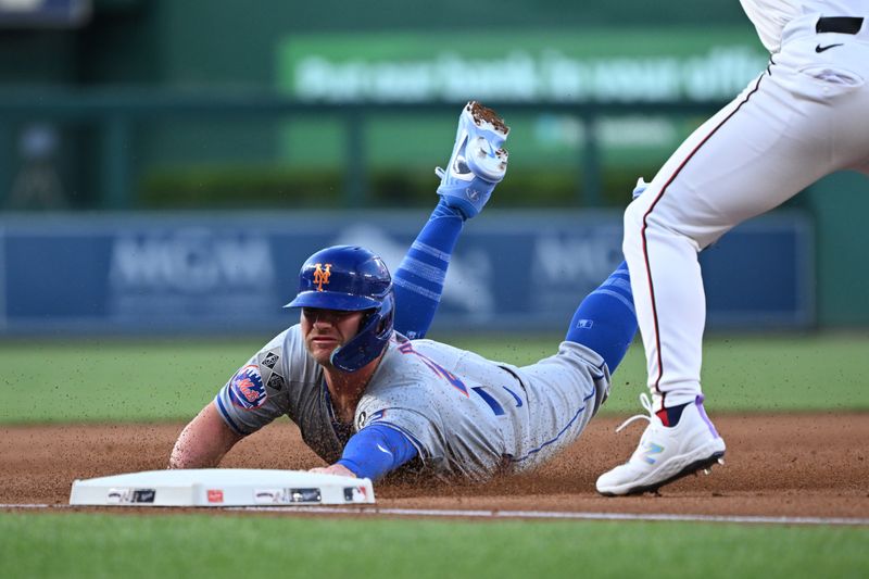 Jul 1, 2024; Washington, District of Columbia, USA; New York Mets first baseman Pete Alonso (20) dives into third base in front of Washington Nationals third baseman Nick Senzel (13) during the fourth inning at Nationals Park. Mandatory Credit: Rafael Suanes-USA TODAY Sports