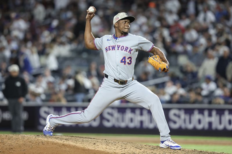 May 18, 2025; Bronx, New York, USA;  New York Mets relief pitcher Huascar Brazobán (43) pitches in the seventh inning against the New York Yankees at Yankee Stadium. Mandatory Credit: Wendell Cruz-Imagn Images