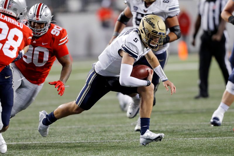 Sep 25, 2021; Columbus, Ohio, USA; Akron Zips quarterback Zach Gibson (5)with the run during the third quarter against the Ohio State Buckeyes at Ohio Stadium. Mandatory Credit: Joseph Maiorana-USA TODAY Sports