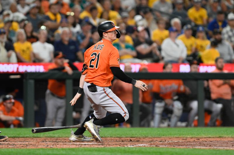 Aug 12, 2023; Seattle, Washington, USA; Baltimore Orioles left fielder Austin Hays (21) hits a single against the Seattle Mariners during the eighth inning at T-Mobile Park. Mandatory Credit: Steven Bisig-USA TODAY Sports