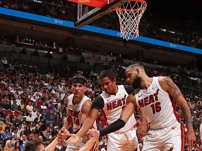 MIAMI, FL - OCTOBER 25: Duncan Robinson #55 of the Miami Heat is helped up by Tyler Herro #14, Dru Smith #9, and Caleb Martin #16 during the game against the Detroit Pistons on October 25, 2023 at Kaseya Center in Miami, Florida. NOTE TO USER: User expressly acknowledges and agrees that, by downloading and or using this Photograph, user is consenting to the terms and conditions of the Getty Images License Agreement. Mandatory Copyright Notice: Copyright 2023 NBAE (Photo by Issac Baldizon/NBAE via Getty Images)