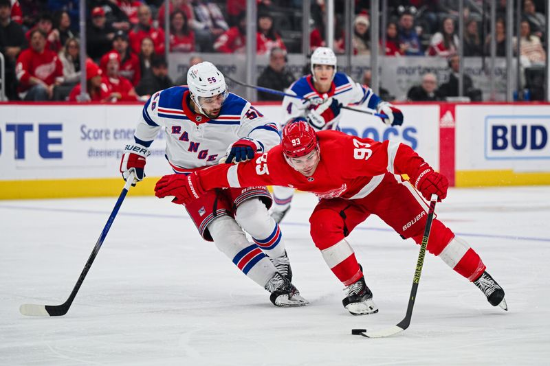 Apr 5, 2024; Detroit, Michigan, USA; Detroit Red Wings right wing Alex DeBrincat (93) brings the puck up ice as New York Rangers defenseman Ryan Lindgren (55) defends during the second period at Little Caesars Arena. Mandatory Credit: Tim Fuller-USA TODAY Sports