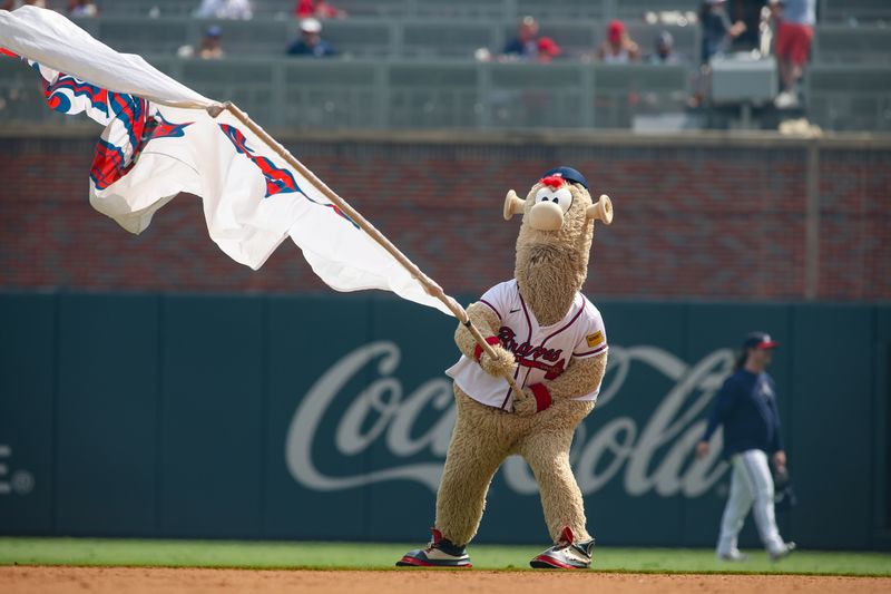 Jul 7, 2024; Atlanta, Georgia, USA; Atlanta Braves mascot Blooper waves a flag after a victory against the Philadelphia Phillies at Truist Park. Mandatory Credit: Brett Davis-USA TODAY Sports
