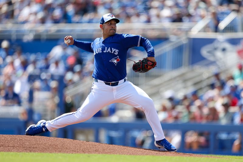 Feb 28, 2024; Dunedin, Florida, USA;  Toronto Blue Jays pitcher Paolo Espino (52) throws a pitch against the Tampa Bay Rays in the first inning at TD Ballpark. Mandatory Credit: Nathan Ray Seebeck-USA TODAY Sports