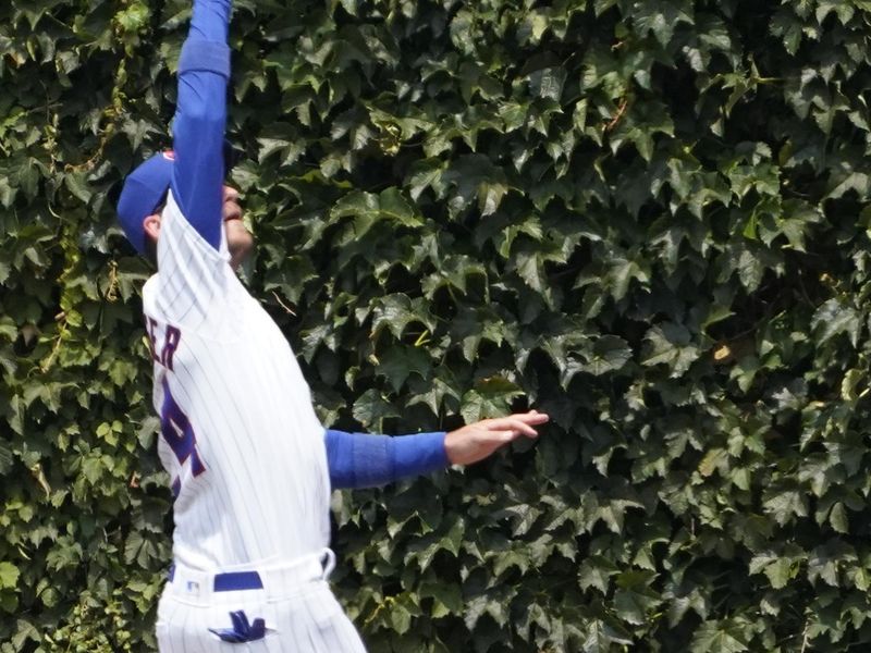 Jul 15, 2023; Chicago, Illinois, USA; Chicago Cubs center fielder Cody Bellinger (24) makes a catch on Boston Red Sox first baseman Triston Casas (not pictured) during the third inning at Wrigley Field. Mandatory Credit: David Banks-USA TODAY Sports