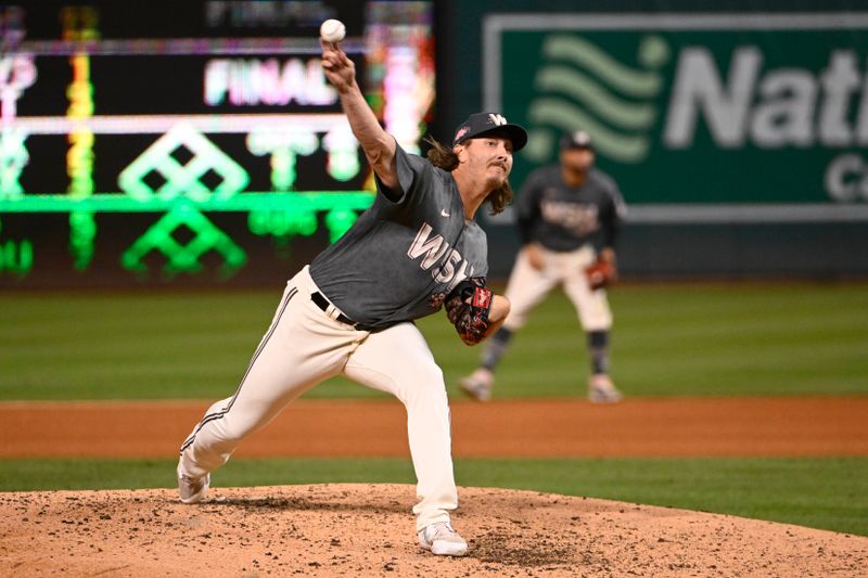 Sep 9, 2023; Washington, District of Columbia, USA; Washington Nationals relief pitcher Hunter Harvey (73) throws to the Los Angeles Dodgers during the seventh inning at Nationals Park. Mandatory Credit: Brad Mills-USA TODAY Sports