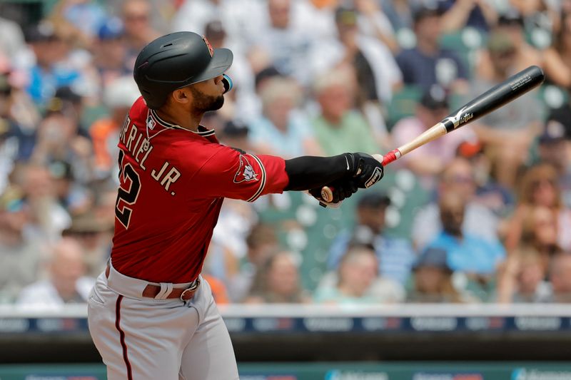 Jun 10, 2023; Detroit, Michigan, USA;  Arizona Diamondbacks designated hitter Lourdes Gurriel Jr. (12) hits a three-run home run in the fifth inning against the Detroit Tigers at Comerica Park. Mandatory Credit: Rick Osentoski-USA TODAY Sports