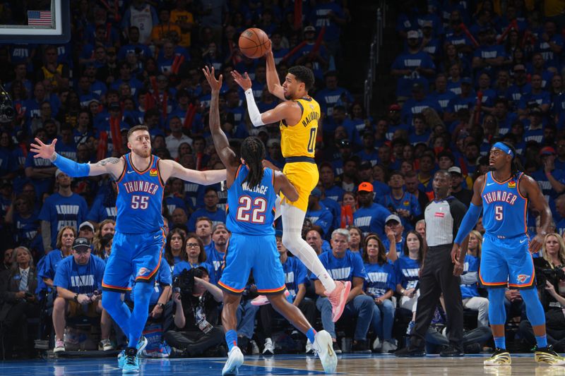 OKLAHOMA CITY, OK - JUNE 8: Tyrese Haliburton #0 of the Indiana Pacers passes the ball during the game against the Oklahoma City Thunder  during Game Two of the 2025 NBA Finals on June 8, 2025 at Paycom Center in Oklahoma City, Oklahoma. NOTE TO USER: User expressly acknowledges and agrees that, by downloading and or using this photograph, User is consenting to the terms and conditions of the Getty Images License Agreement. Mandatory Copyright Notice: Copyright 2025 NBAE (Photo by Jesse D. Garrabrant/NBAE via Getty Images)