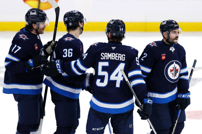 Nov 19, 2024; Winnipeg, Manitoba, CAN; Winnipeg Jets center Morgan Barron (36) celebrates his third period goal against the Florida Panthers at Canada Life Centre. Mandatory Credit: James Carey Lauder-Imagn Images