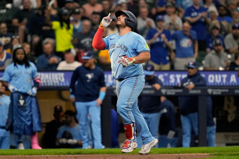 Jun 10, 2024; Milwaukee, Wisconsin, USA;  Toronto Blue Jays catcher Alejandro Kirk (30) celebrates while rounding the bases after hitting a home run during the third inning against the Milwaukee Brewers at American Family Field. Mandatory Credit: Jeff Hanisch-USA TODAY Sports