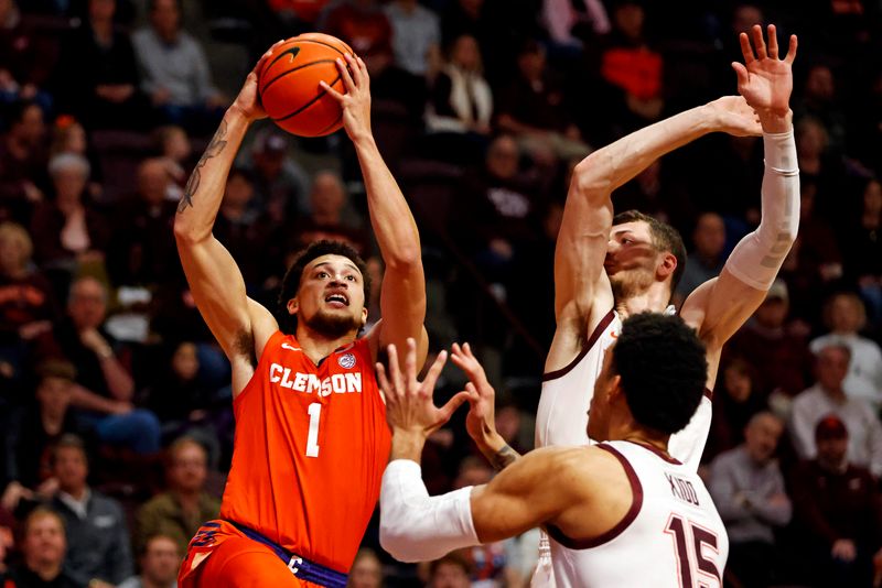 Jan 10, 2024; Blacksburg, Virginia, USA; Clemson Tigers guard Chase Hunter (1) shoots the ball against Virginia Tech Hokies forward Mylyjael Poteat (34) and center Lynn Kidd (15) during the first half at Cassell Coliseum. Mandatory Credit: Peter Casey-USA TODAY Sports