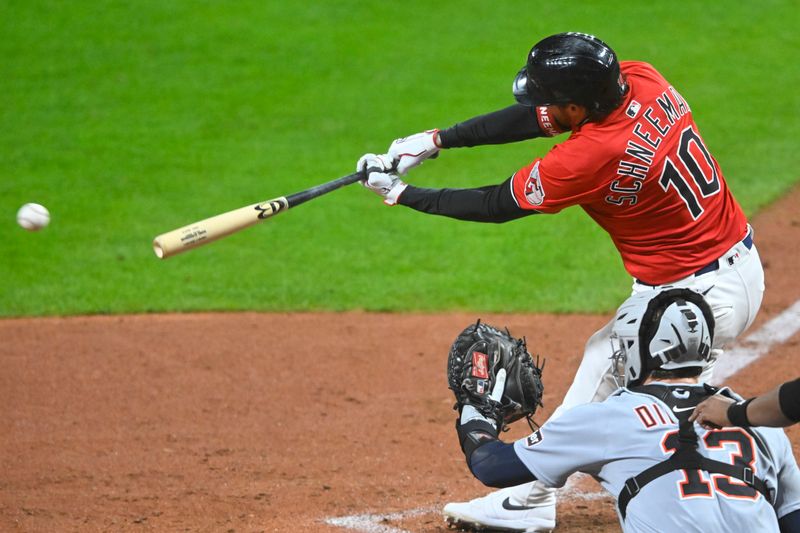 Sep 23, 2025; Cleveland, Ohio, USA; Cleveland Guardians pinch hitter Daniel Schneemann (10) hits a two-RBI single in the seventh inning against the Detroit Tigers at Progressive Field. Mandatory Credit: David Richard-Imagn Images